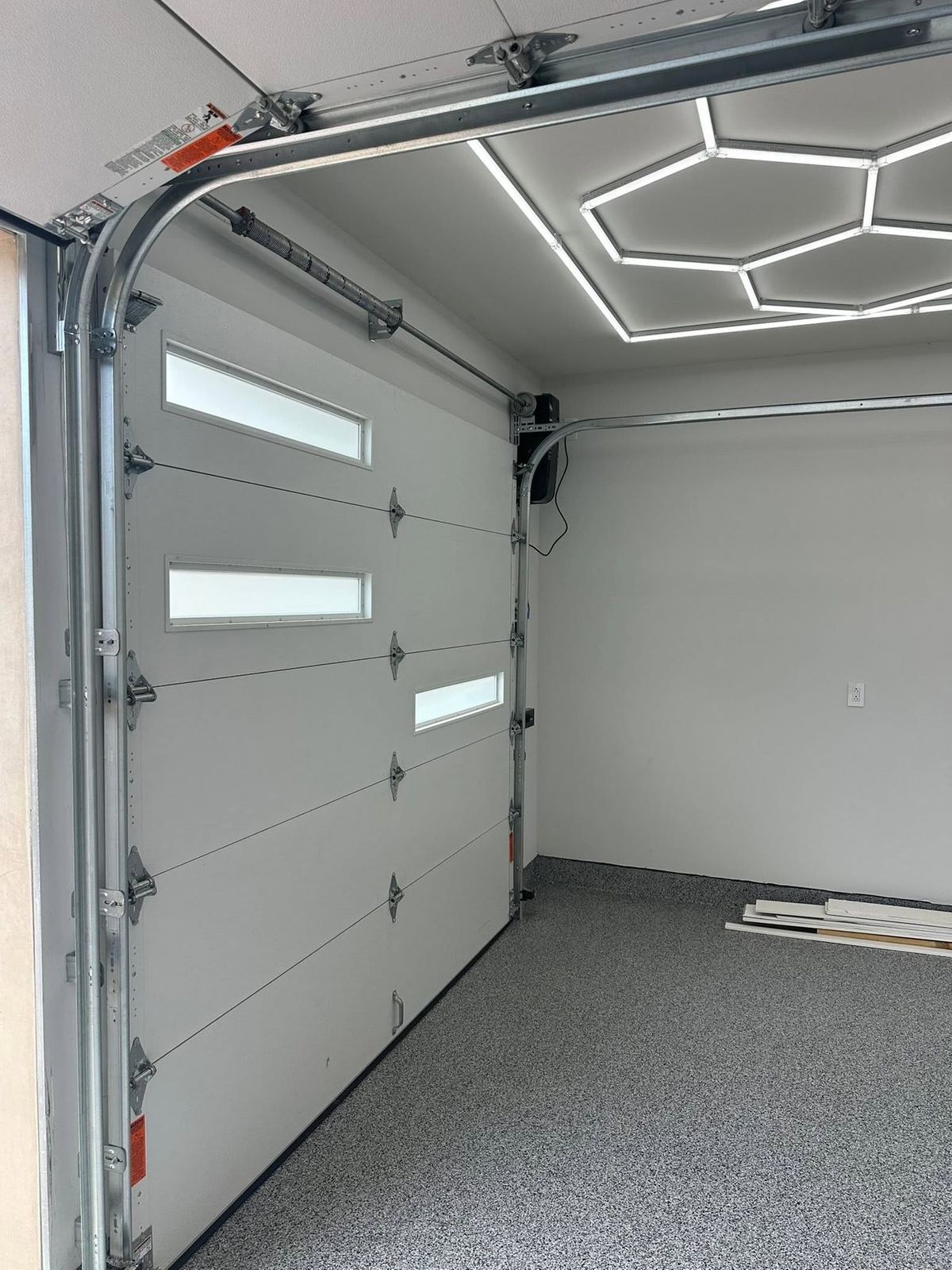 Modern garage door installation with LED lighting